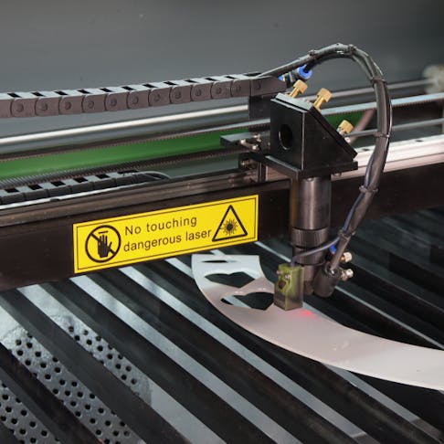 Laser cutter in process. Image Credit: Shutterstock.com/Huufworks