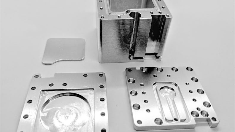 These CNC machined parts are the main fuel tank (top right), the heater base plate (bottom left), the fuel presser plate(top left), and the bottom right is the fuel tank cover