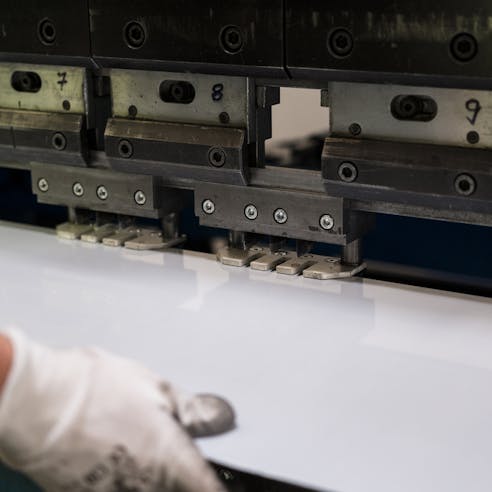 Bending aluminum sheet. Image Credit: Shutterstock.com/Skinfaxi