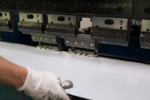 Bending aluminum sheet. Image Credit: Shutterstock.com/Skinfaxi