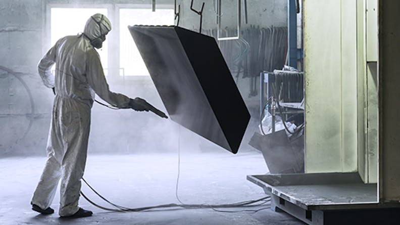 Worker Bead Blasting a Metal Box