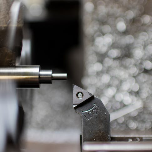 Step turning on a lathe. Image Credit: Shutterstock.com/akiti