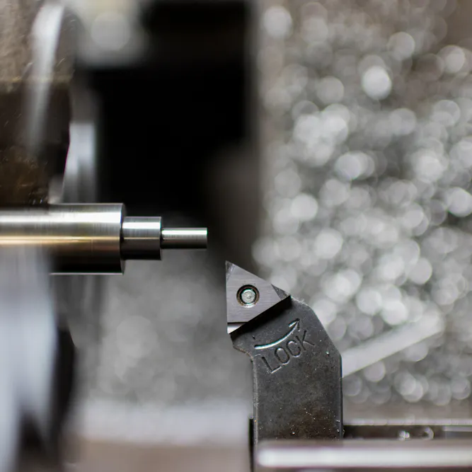 Step turning on a lathe. Image Credit: Shutterstock.com/akiti