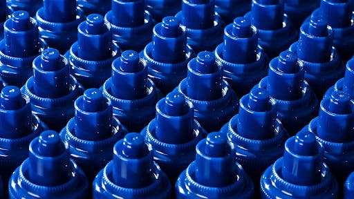 a multitude of blue injection molded parts