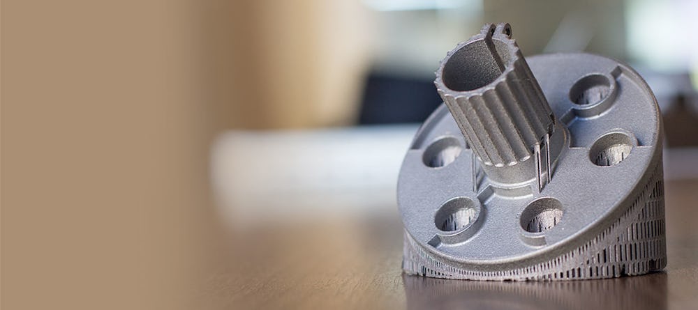 A metal 3D printed aluminum part with its support structures