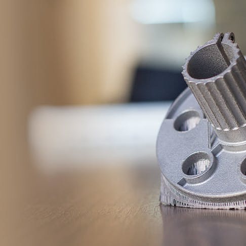 A metal 3D printed aluminum part with its support structures