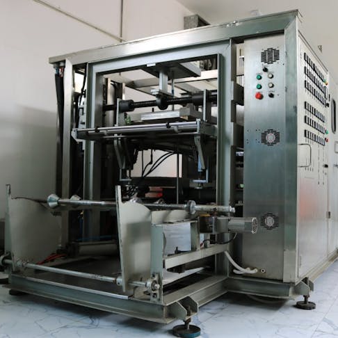 A vacuum thermoforming machine. Image Credit: anlomaja/Shutterstock.com