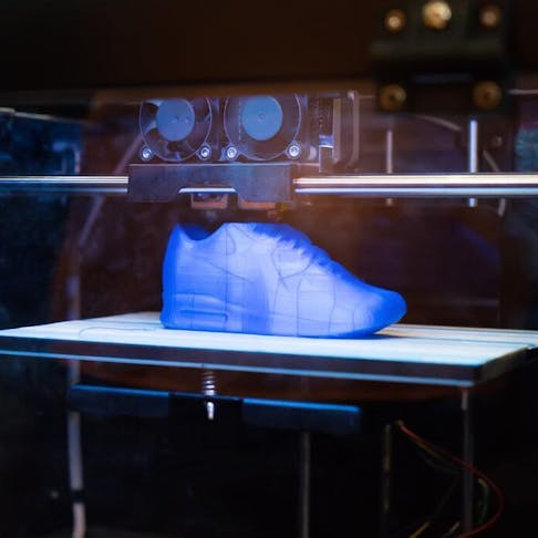 Blue 3D printed sneaker. Image Credit: Shutterstock.com/asharkyu