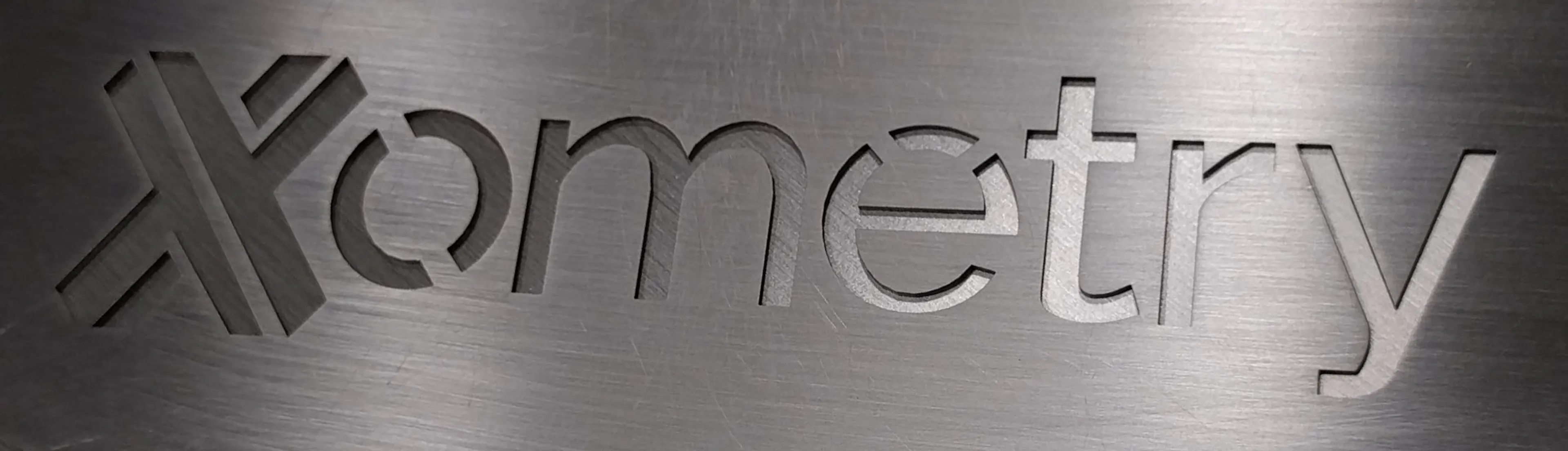 An example of "stencilized" text on a sheet cut part.