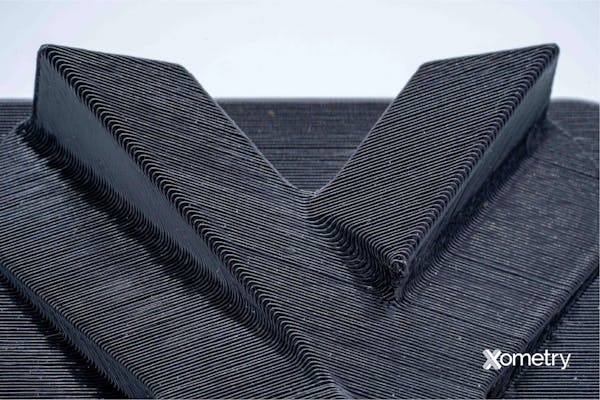 Close-up image of an FDM 3D printed part by Xometry.