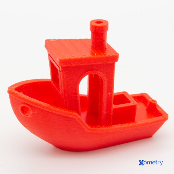 An FDM part printed with Xometry's red PLA.