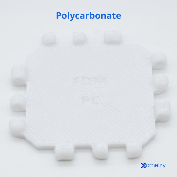 A sample of Xometrys polycarbonate material.