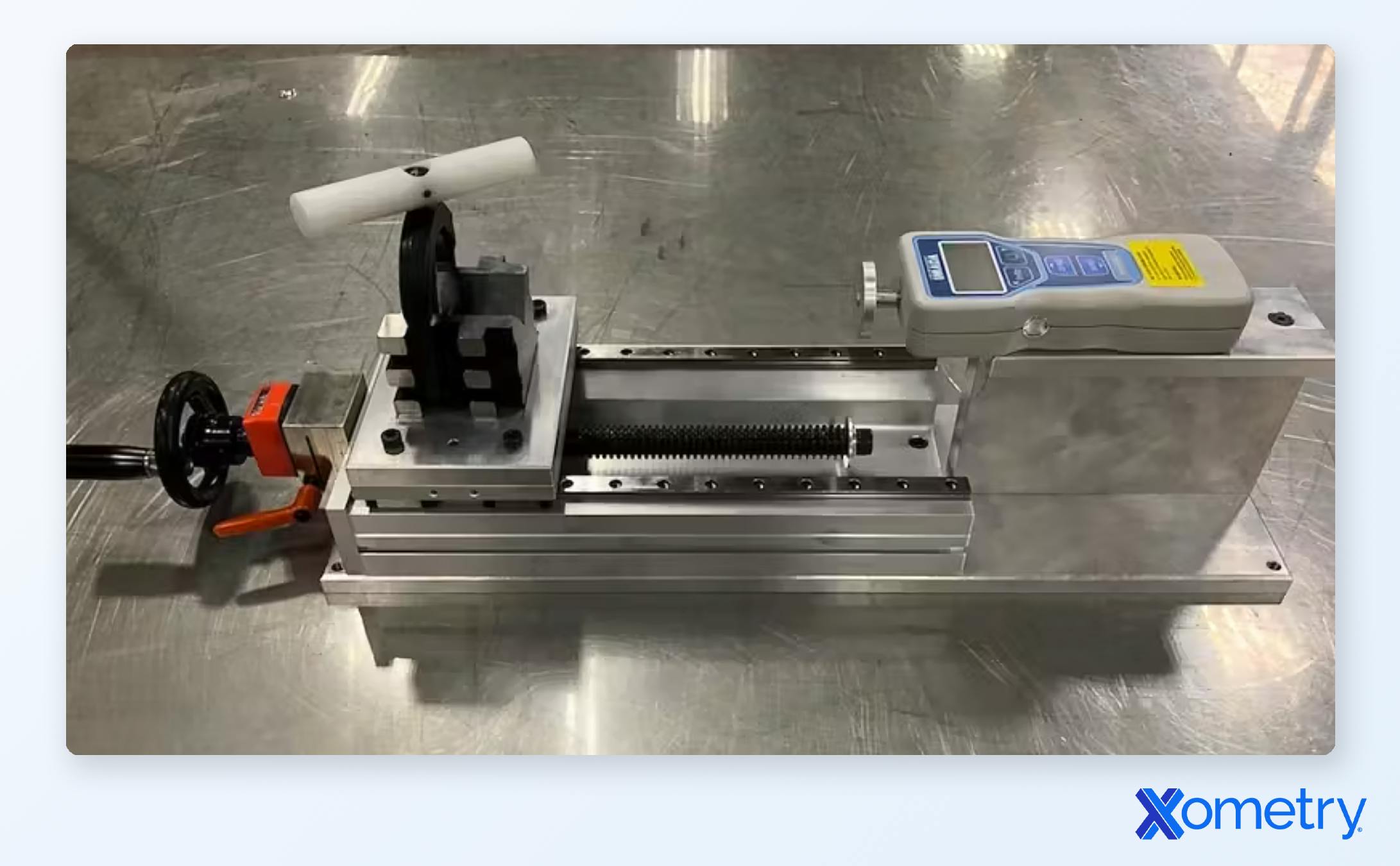 A Xometry-manufactured assembly used to measure the displacement of car parts. The assembly comprises machined parts as well as stock hardware.