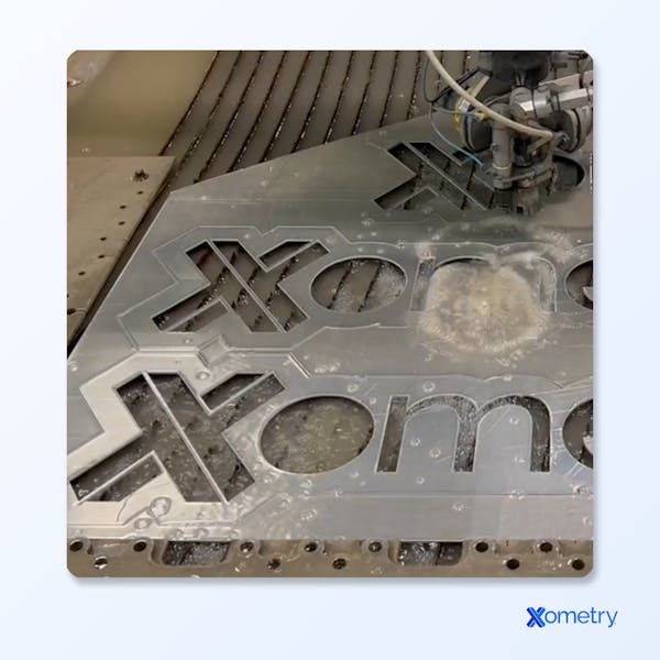 water jet cut Xometry logo