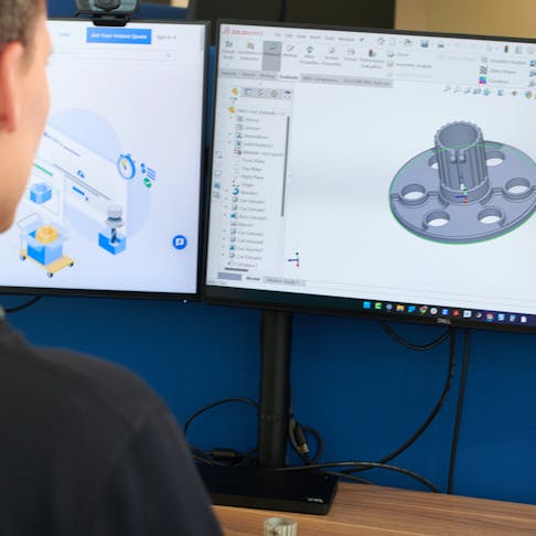 Person working with CAD at their computer.