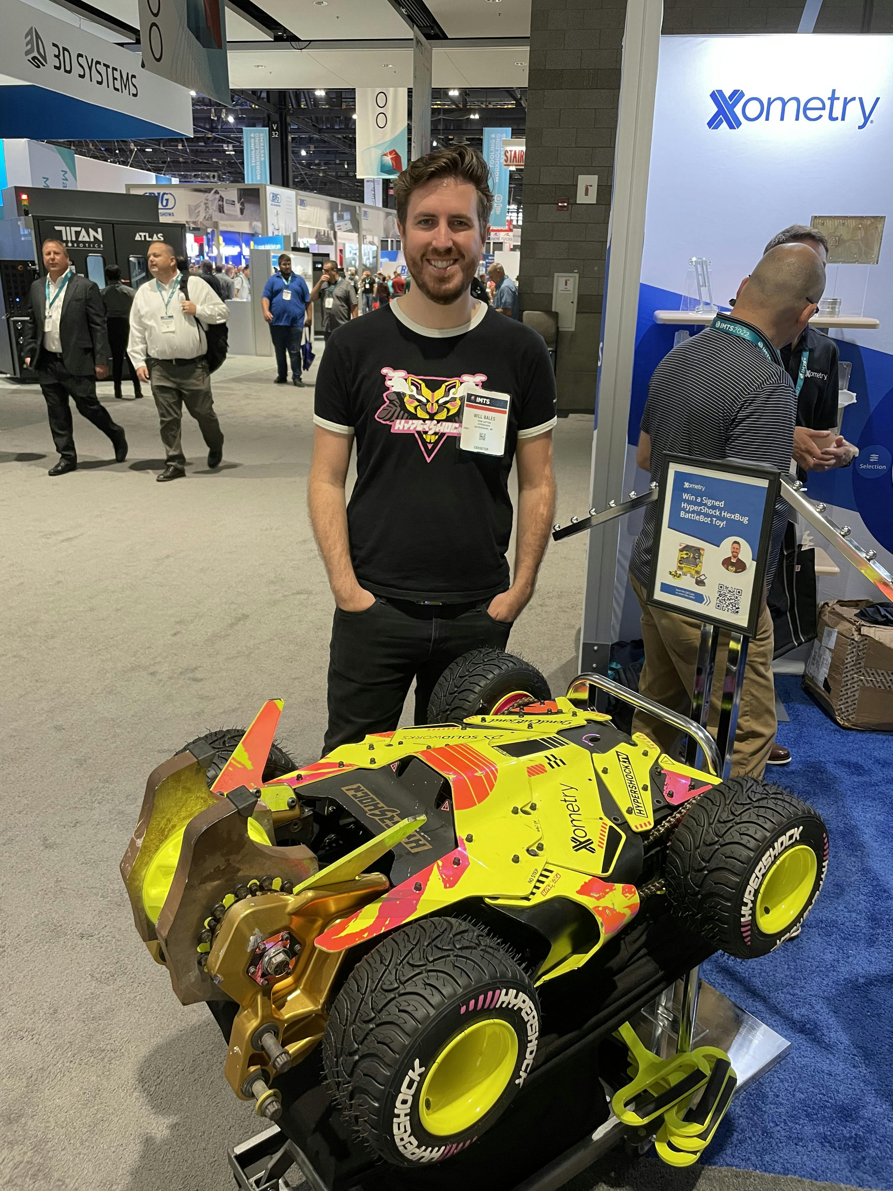 a picture of Will Bales standing next to the hypershock battlebot