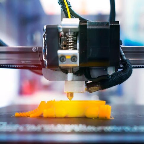 Yellow 3D printed object. Image Credit: Shutterstock.com/asharkyu