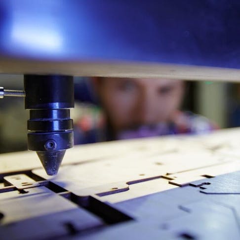 Laser cutting wooden parts. Image Credit: Shutterstock.com/Pressmaster