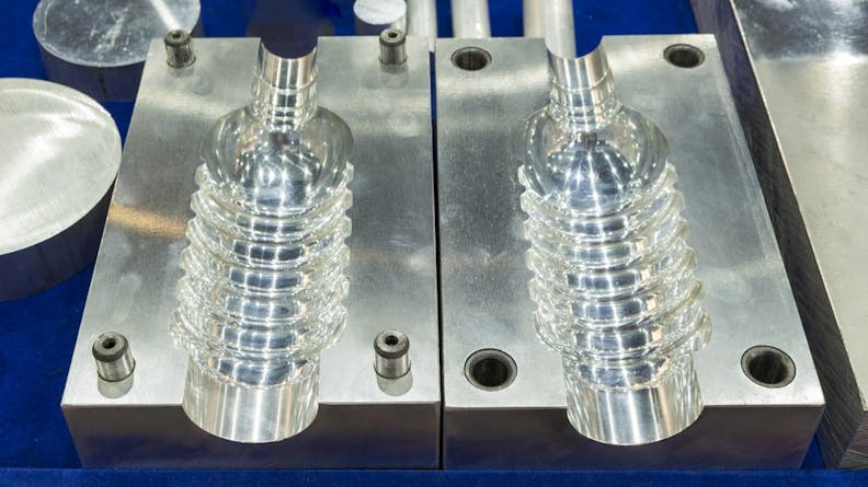 Plastic bottles being molded.