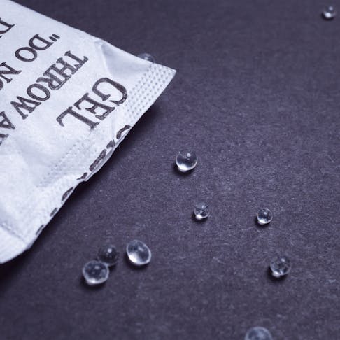 Silica gel packet. Image Credit: Shutterstock.com/FrameAngel