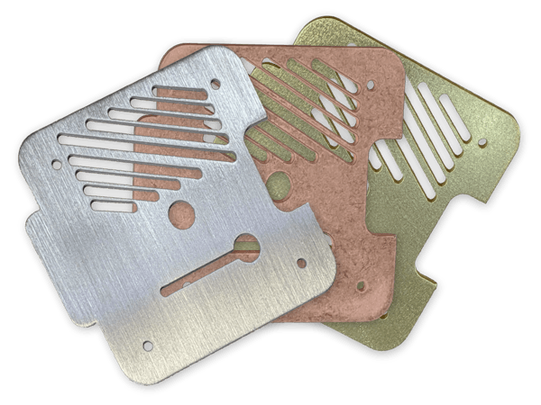 An array of sheet metal parts of different materials and finishes.