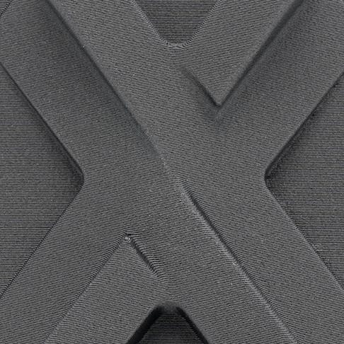 Xometry X-tile printed in Nylon 6 CF via FDM.
