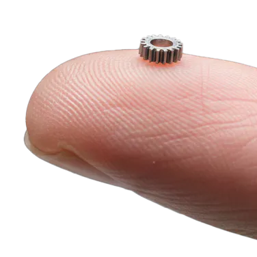 A micro-machined part sitting on a fingertip.