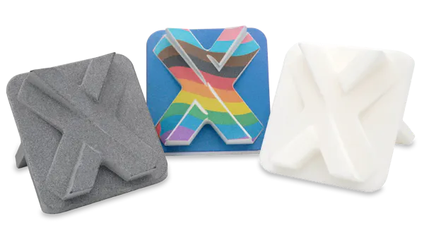 A group of MJF printed parts in different materials.