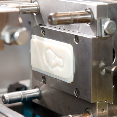 A small mold inserted into an injection molding machine. Image Credit: Shutterstock.com/Moreno Soppelsa