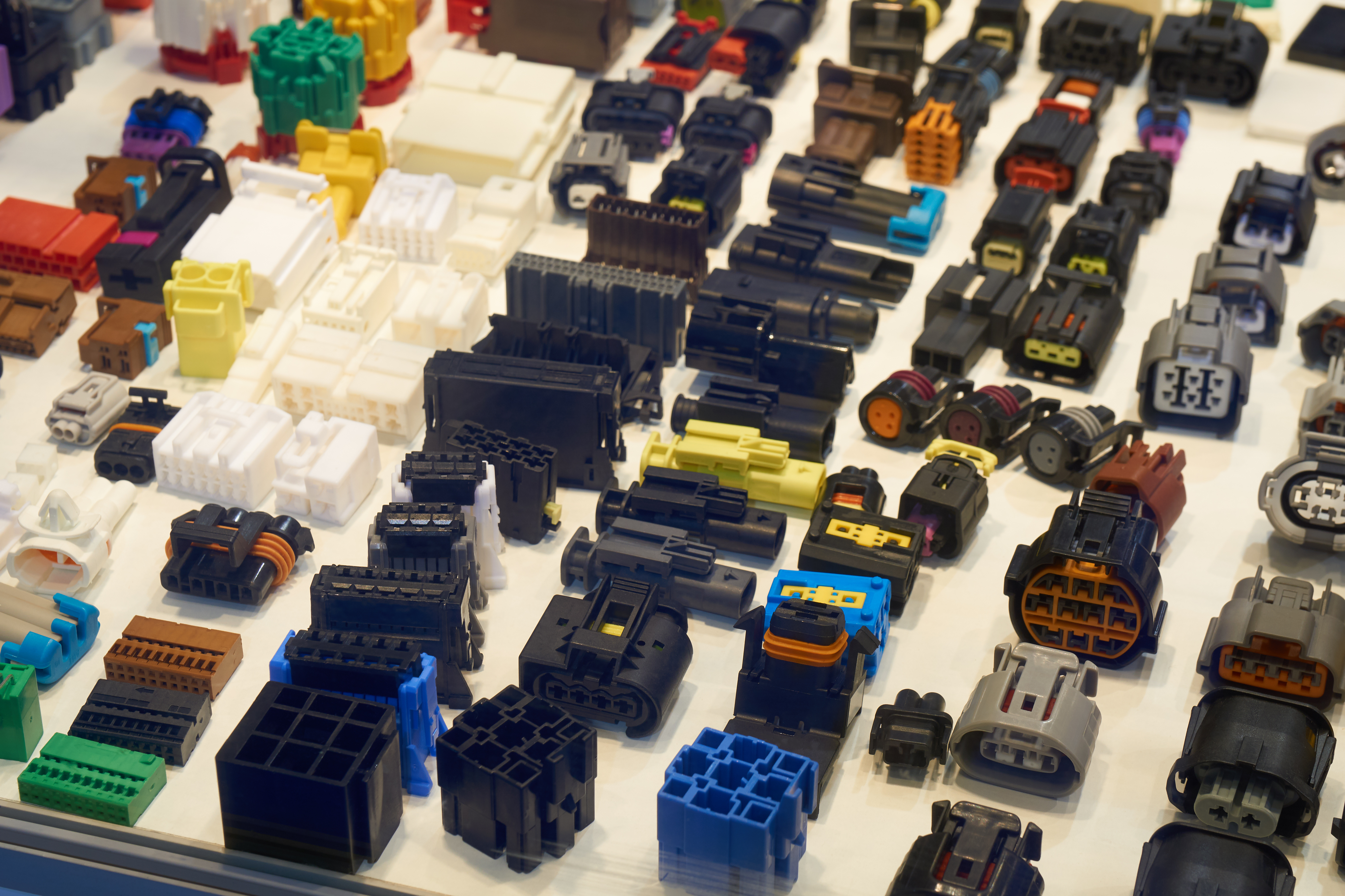 Various plastic injection molded connectors for the automotive industry.