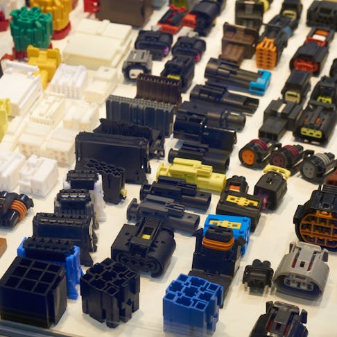 Various plastic injection molded connectors for the automotive industry.