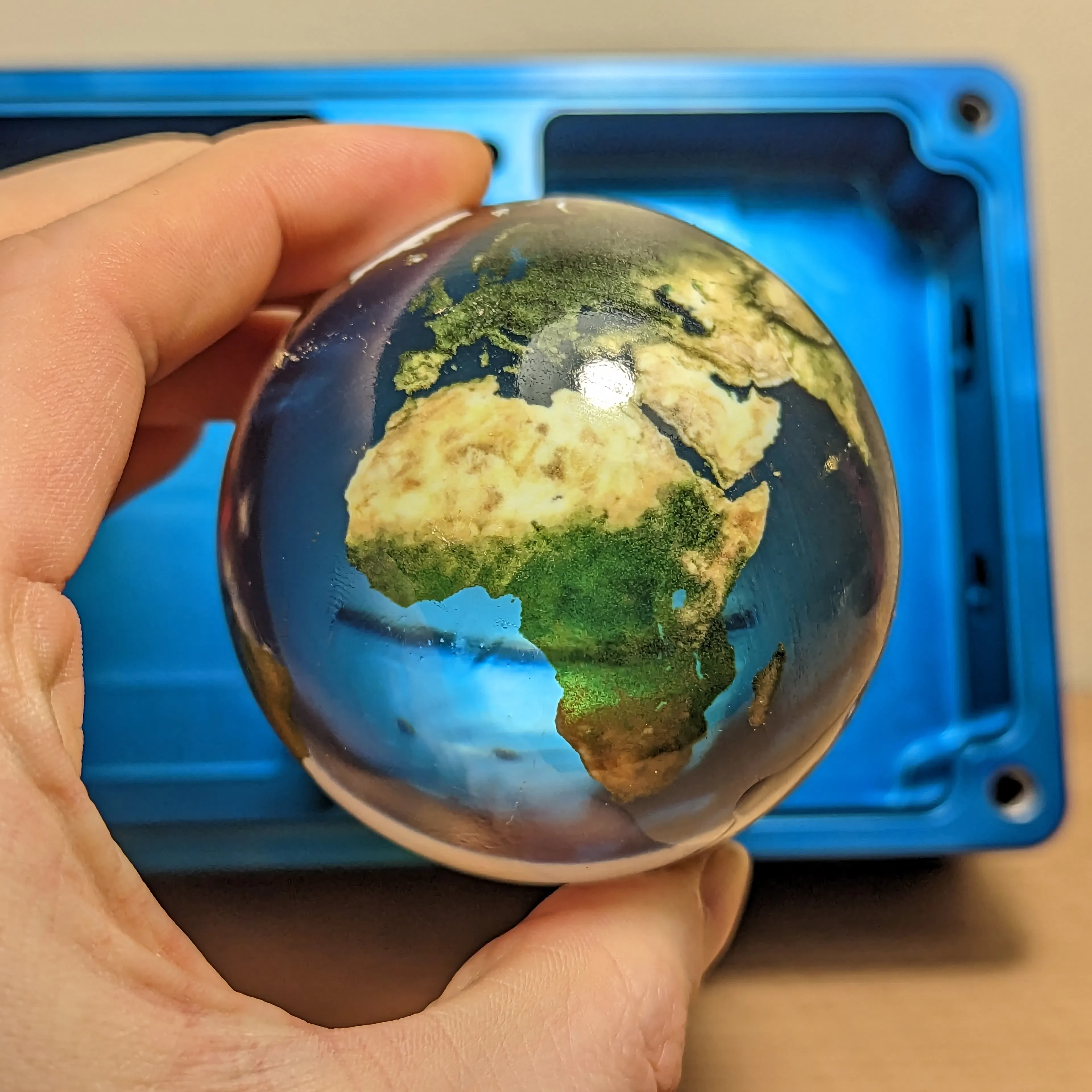 A full-color part with a polished and clear coated finish, made using Xometry's PolyJet service.