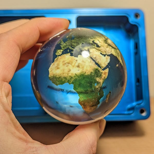 A full-color part with a polished and clear coated finish, made using Xometry's PolyJet service.