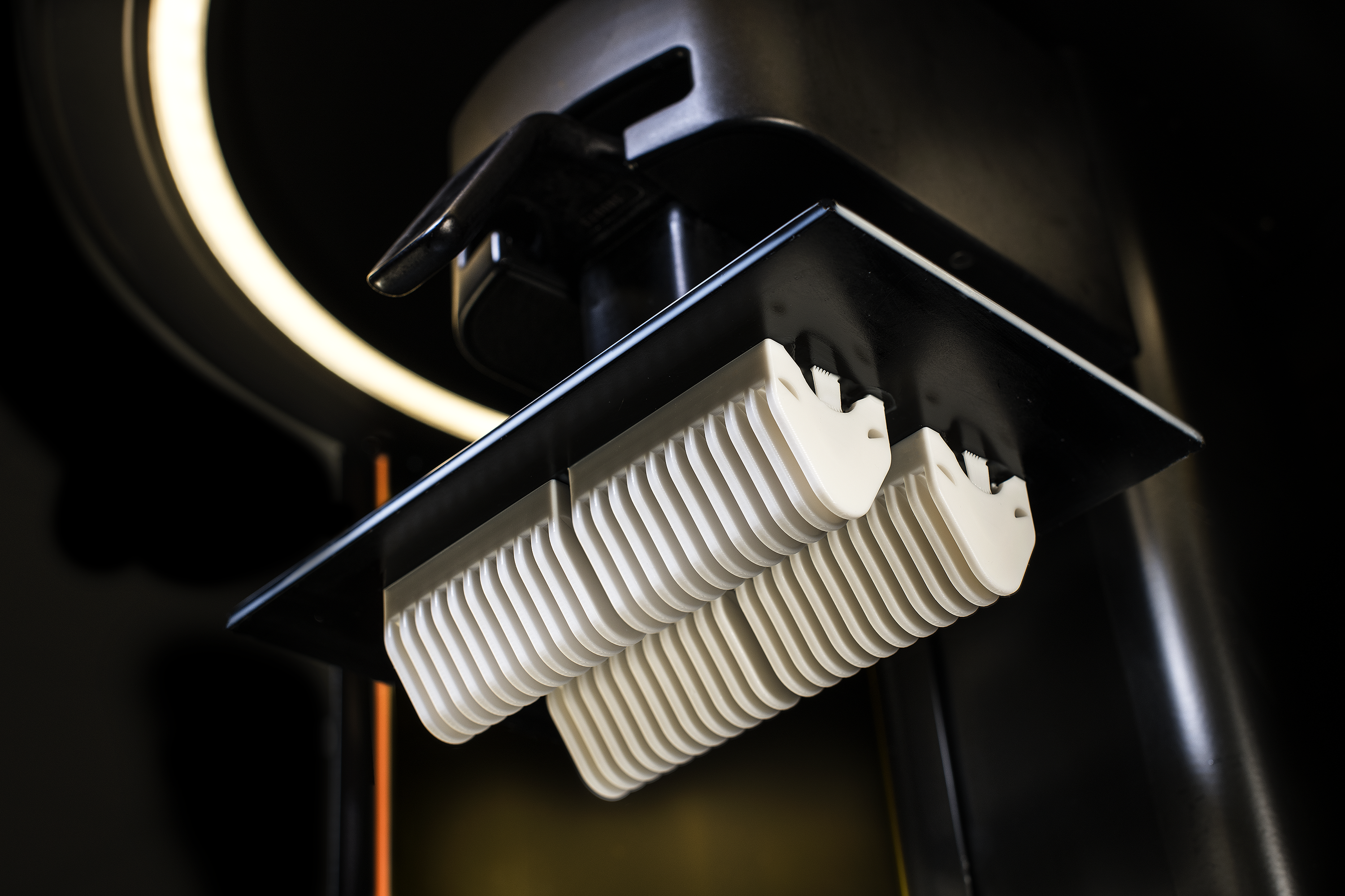 MPU 100 parts attached to build platform of Carbon DLS machine.