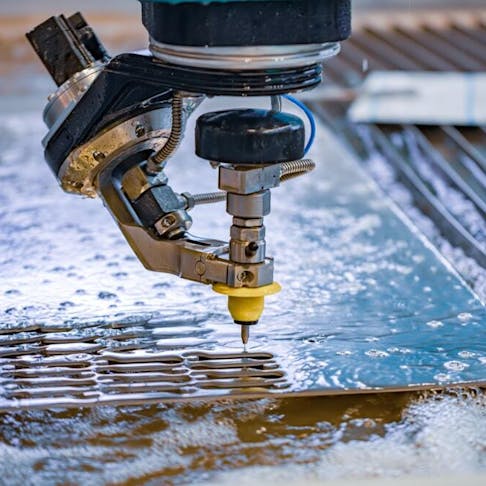 Waterjet cutting machine in process. Image Credit: Shutterstock.com/Andrey Armyagov