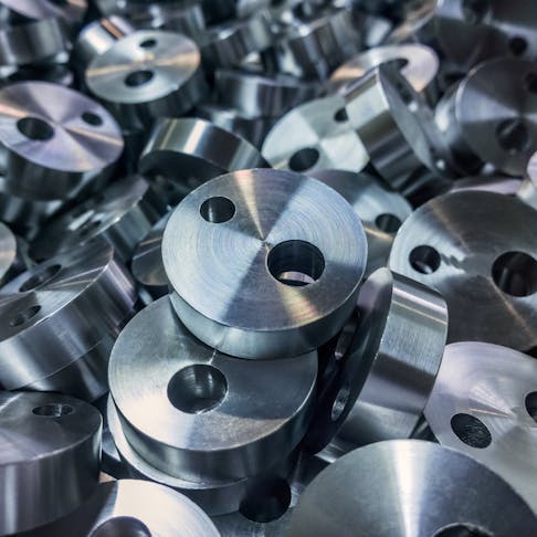 Machined metal parts scale to production through CNC services. Image Credit: FreePik.com/shyachlo