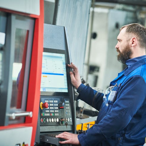 CNC machining in progress. Image Credit: Shutterstock.com/Dmitry Kalinovsky