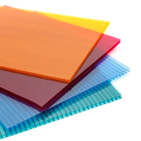 Colorful polycarbonate plastic sheets on a white background. Image Credit: Cat Us/Shutterstock.com