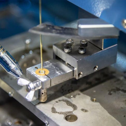 Drilling machine making hole for wire EDM. Image Credit: Shutterstock.com/Pixel B