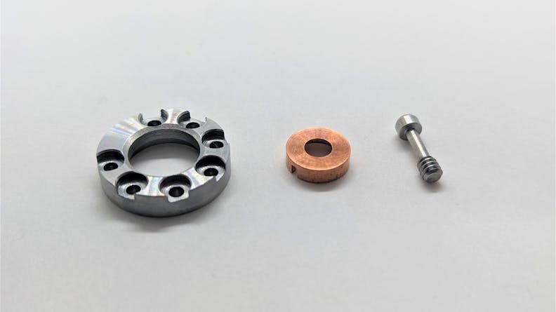 These CNC machined parts attach to the thruster. The left part is the pole piece cap, the middle part is the copper anode, and the part on the right is the center pole piece.