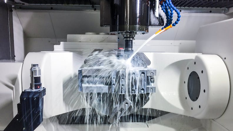 A 5 axis machine where the mill head moves planar and up and down, and the workpiece can tilt and rotate.