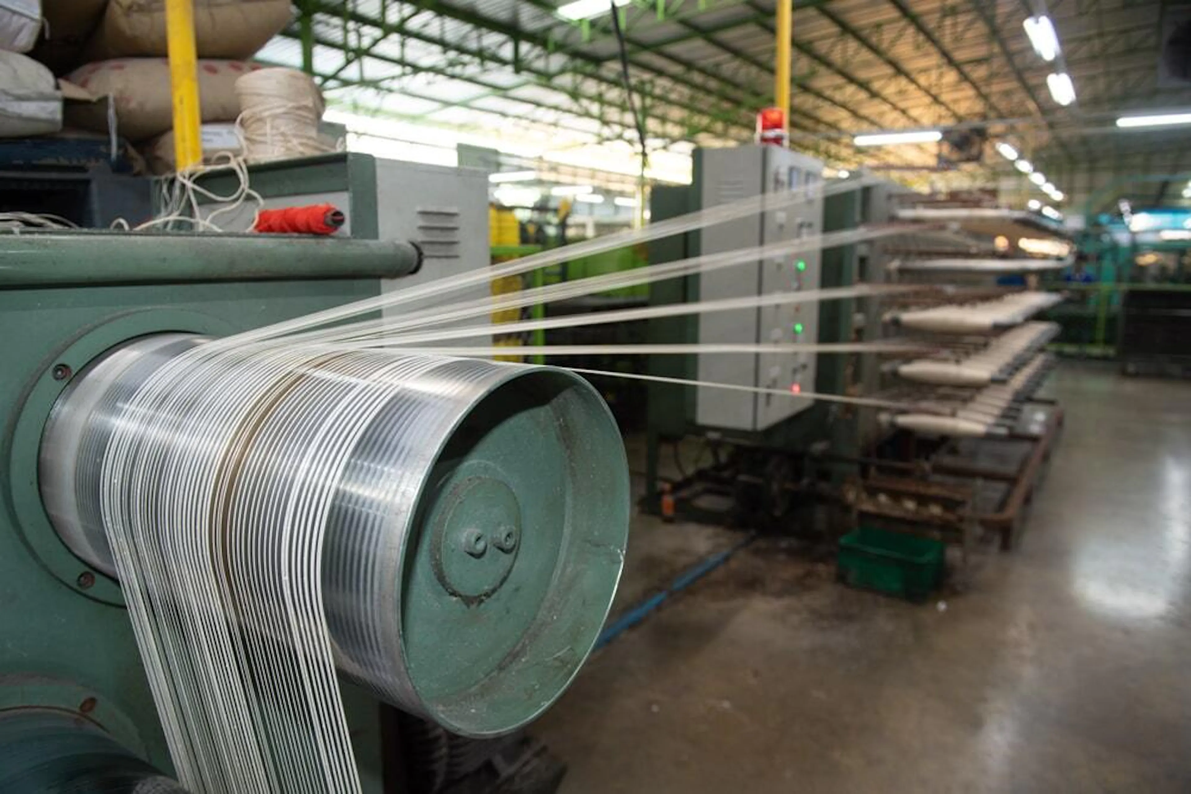 Production of nylon in a thread factory. Image Credit: saravutpics/Shutterstock.com
