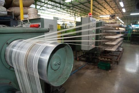 Production of nylon in a thread factory. Image Credit: saravutpics/Shutterstock.com