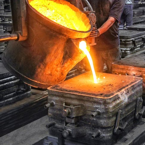 Liquid metal being poured into a mold. Image Credit: Funtay/Shutterstock.com