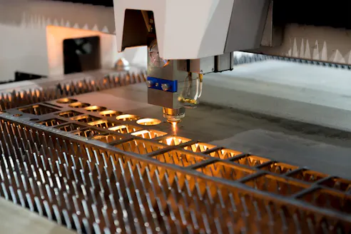 Laser cutting sheet metal. Image Credit: Shutterstock.com/Travelpixs