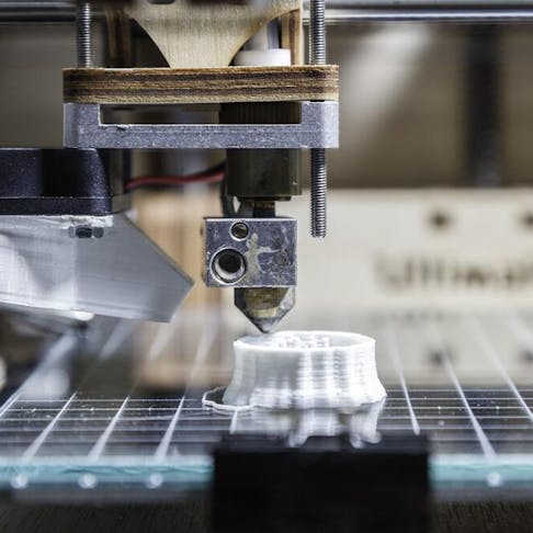 3D printer printing an object. Image Credit: Shutterstock.com/Sergi Lopez Roig