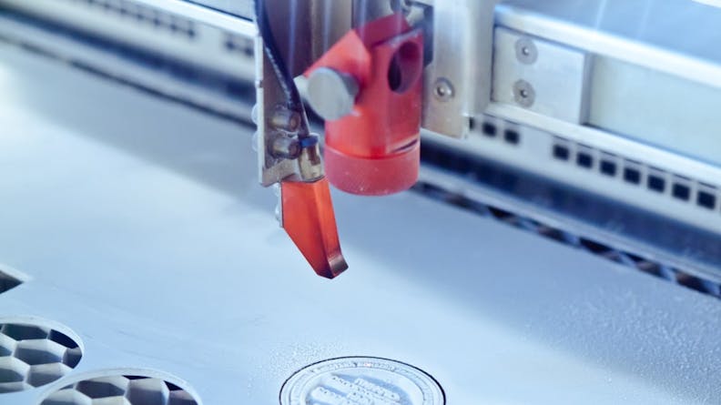 A laser engraving machine is used to create stamping dies.