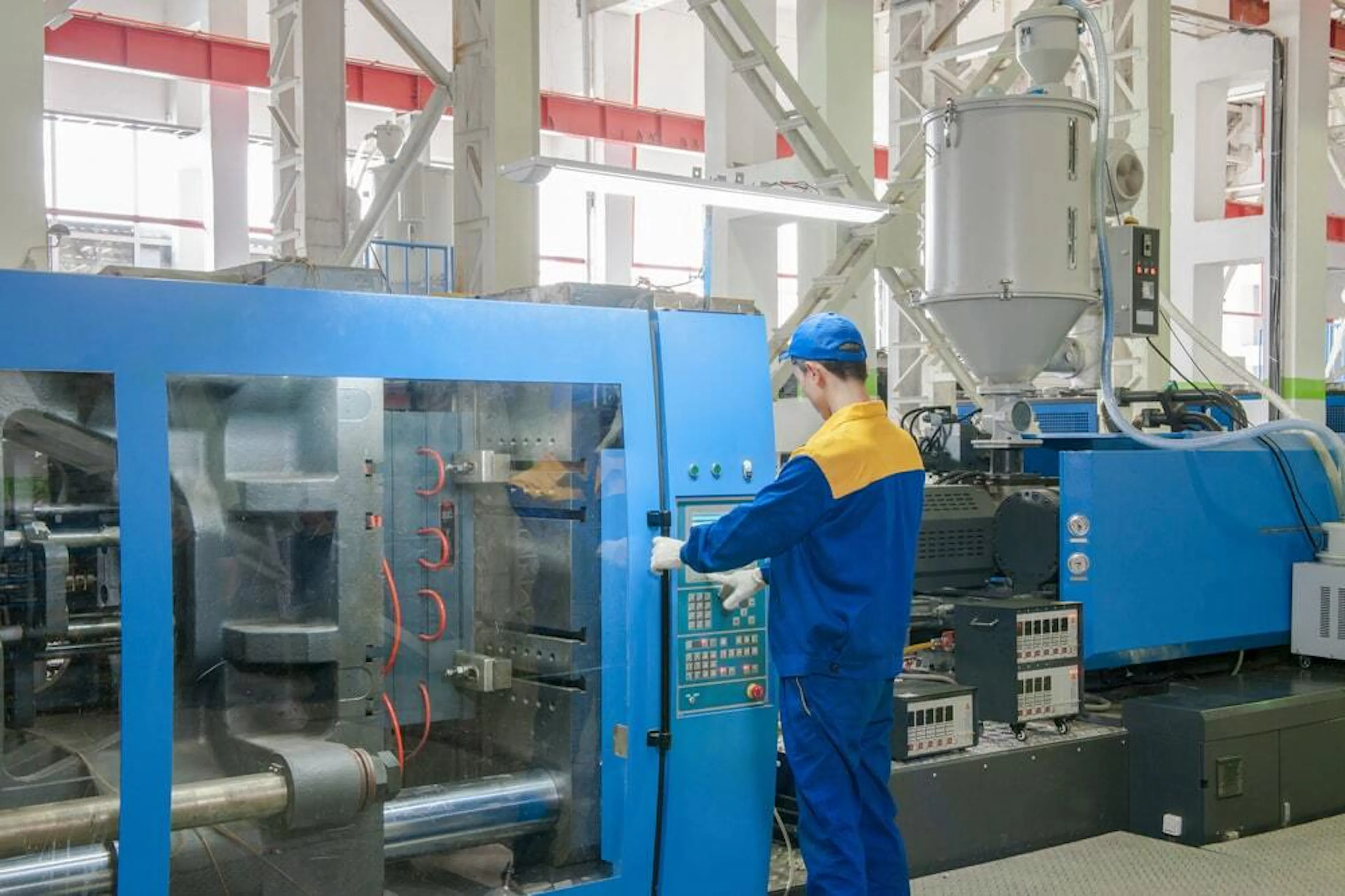 Industrial injection molding press machine. Image Credit: Alba_alioth/Shutterstock.com