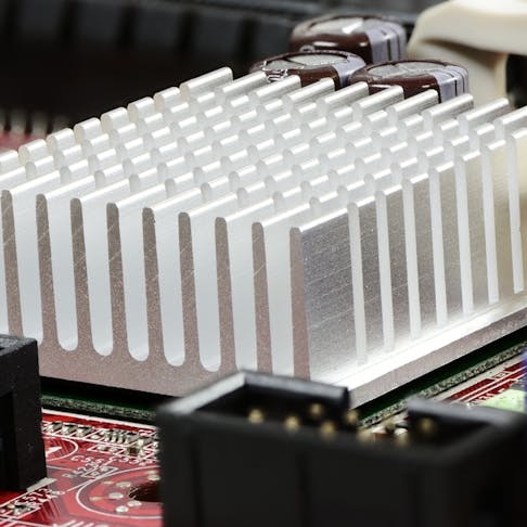 Heat sink on mainboard of computer. Image Credit: Shutterstock.com/manfredxy