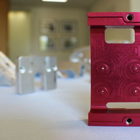 red and silver CNC machined parts